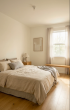 Lichtdurchflutete 2-Zimmer-Wohnung mit Balkon im KFW-40-QNG Standard - Schlafzimmer.png