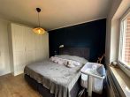 Charmanter Bungalow mit Wintergarten & ausbaufähigem Dachgeschoss | PV Anlage & Wallbox - Schlafzimmer 1.JPG