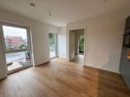 Moderne 2-Zimmer-Neubauwohnung mit Balkon und Stellplatz - Wohn- Essbereich.jpg
