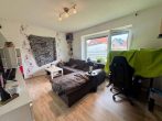 Vielseitiges Ein- oder Zweifamilienhaus in Bümmerstede mit Terrasse, Garage und attraktivem Grundstück - Wohnzimmer EG1.jpg